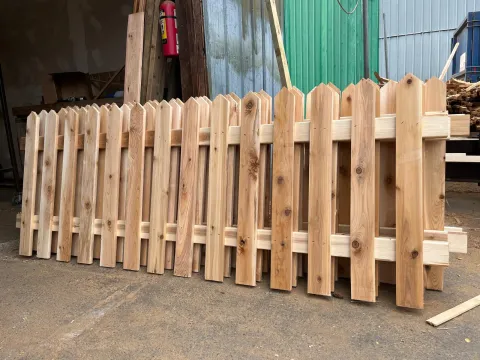 Cedar picket fence sections in the workshop